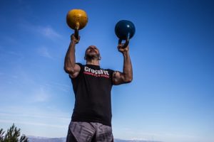 person holding kettlebells